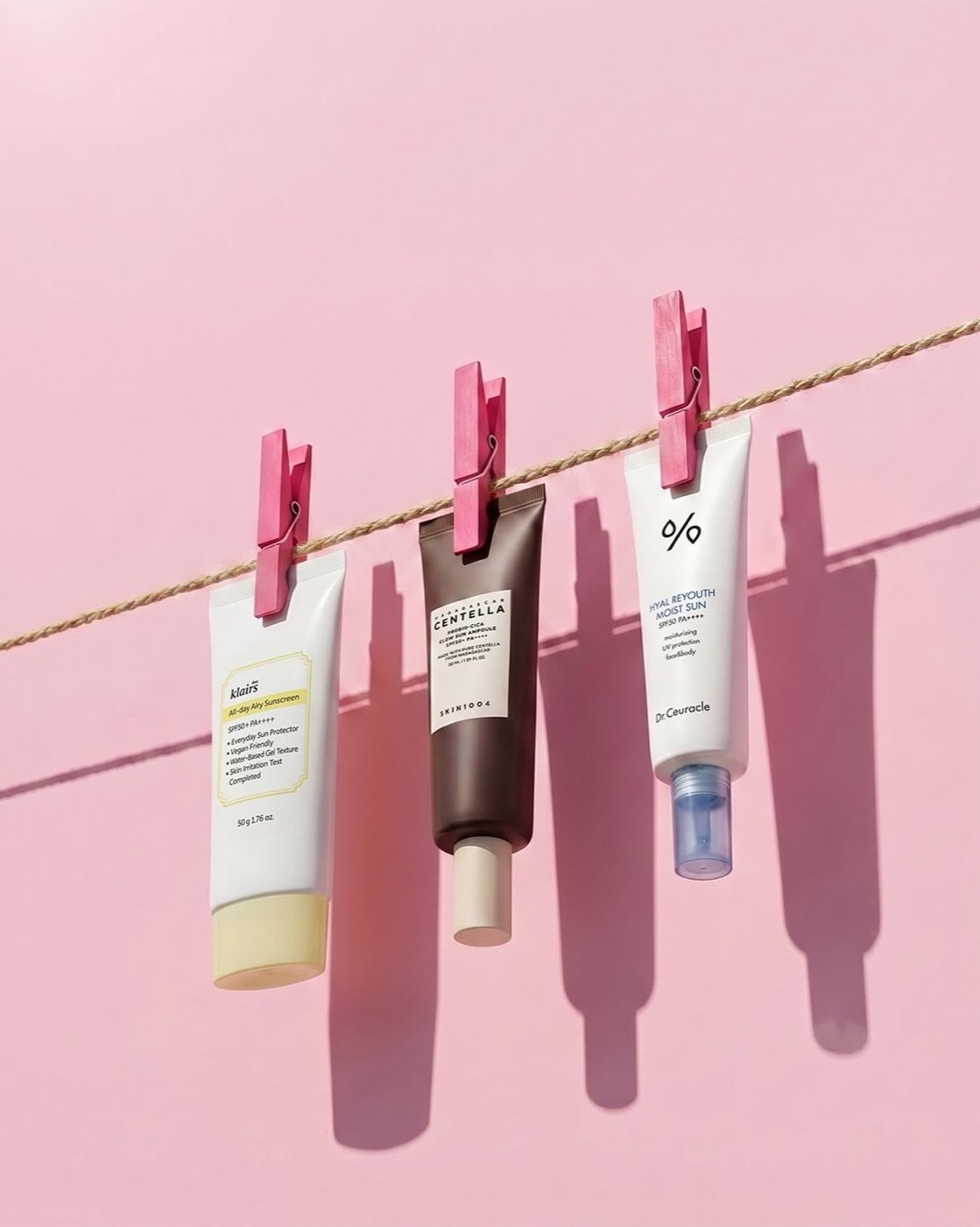 Skincare product visuals hanging on a clothesline